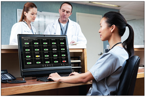 Healthcare employee at their station using the Masimo Patient SafteyNet software on their desktop computer